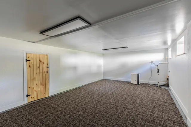 a view of a big room with closet and wooden floor