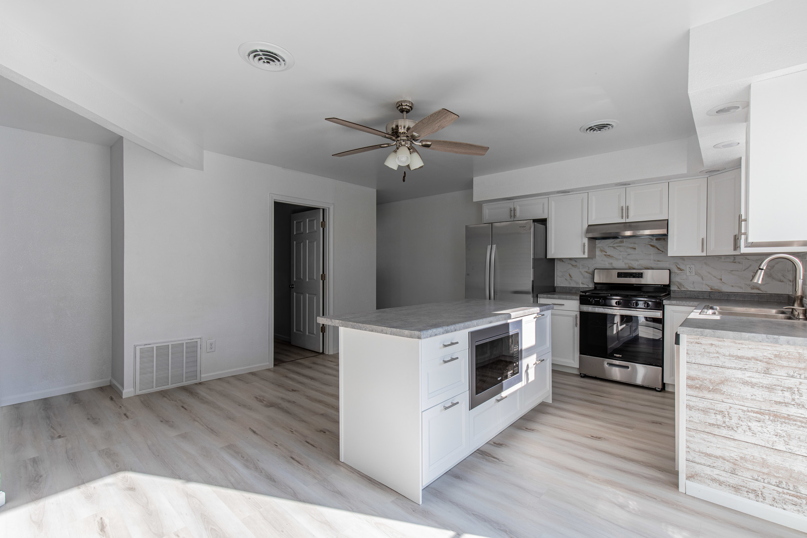 519 East Dakota Street Spring Valley, IL 61362 - Photo 5 of 23 a kitchen with granite countertop a stove top oven and cabinets