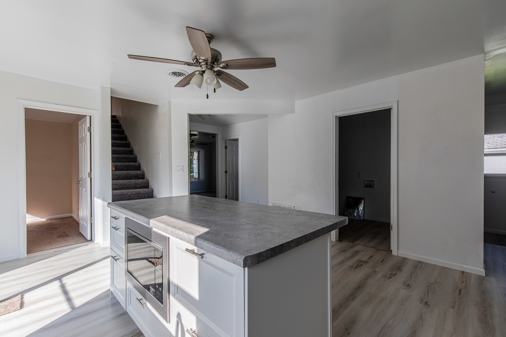 519 East Dakota Street Spring Valley, IL 61362 - Photo 8 of 23 a view of kitchen island with cabinets and wooden floor