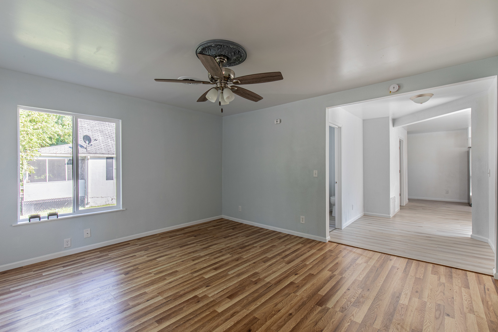 519 East Dakota Street Spring Valley, IL 61362 - Photo 10 of 23 a view of empty room with wooden floor and fan