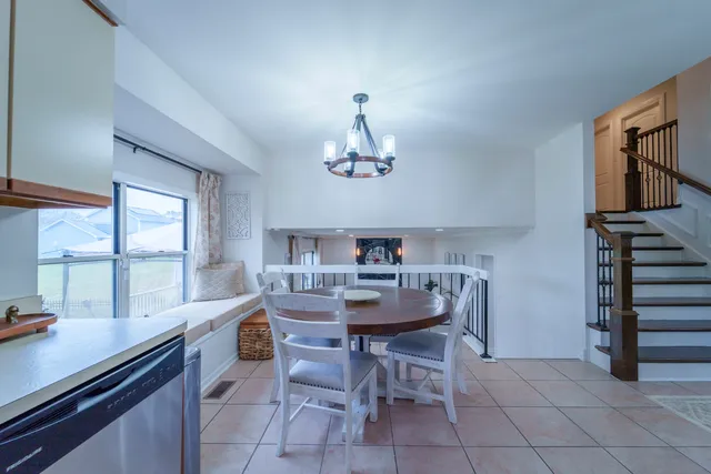 a kitchen with stainless steel appliances granite countertop a stove top oven a sink dishwasher and a microwave oven on the blue kitchen countertops