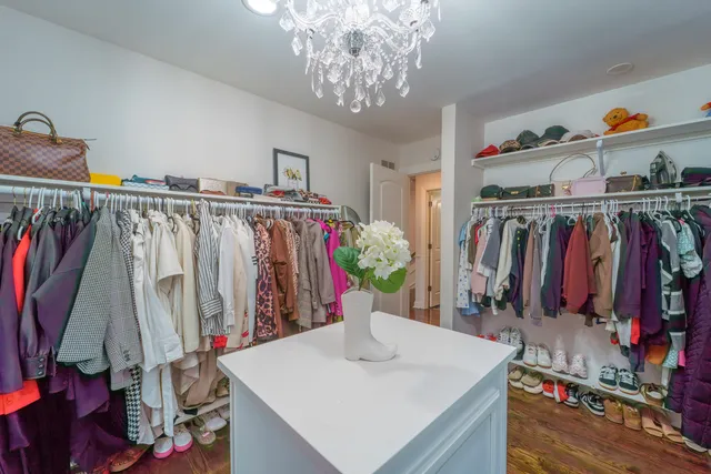 a bathroom with a toilet a sink and glass door