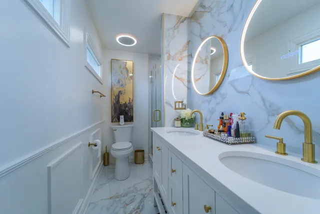 a spacious bathroom with a double vanity sink and a mirror