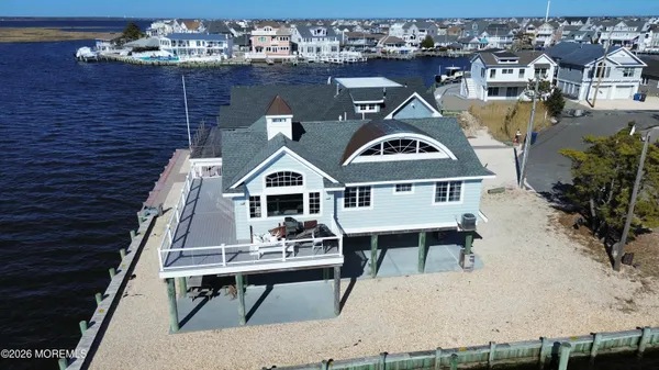 a view of a house with a wooden deck