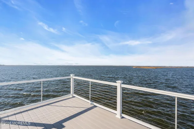 a view of a balcony with an ocean view