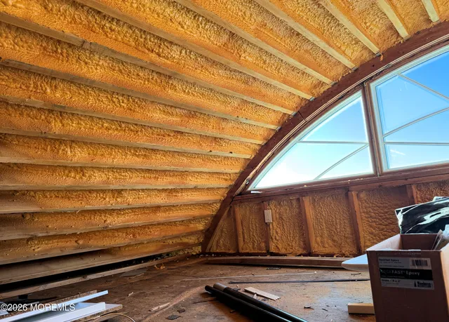 a view of room with wooden floor