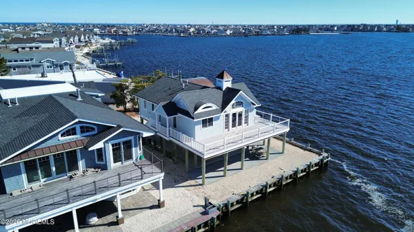 an aerial view of a house with a ocean view