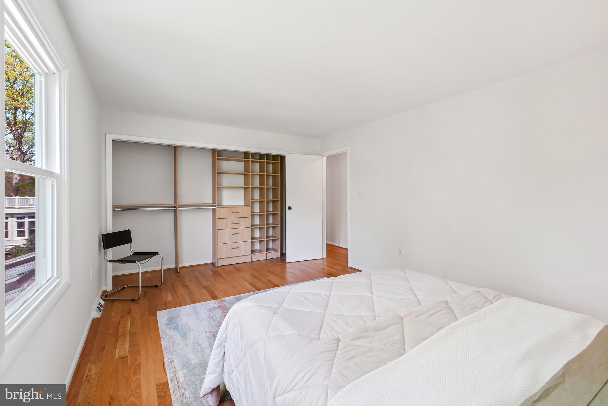 10908 Howland Drive Reston, VA 20191 - Photo 27 of 46 a bedroom with a bed and a large window