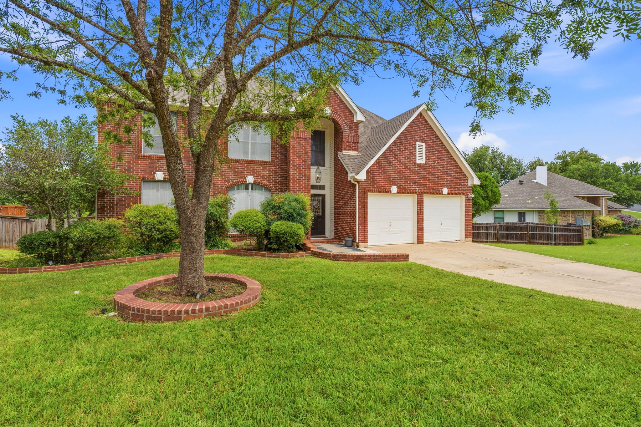 8317 Pommel Drive Austin, TX 78759 - Photo 3 of 26 A well-maintained brick exterior and two-car garage define this inviting property.