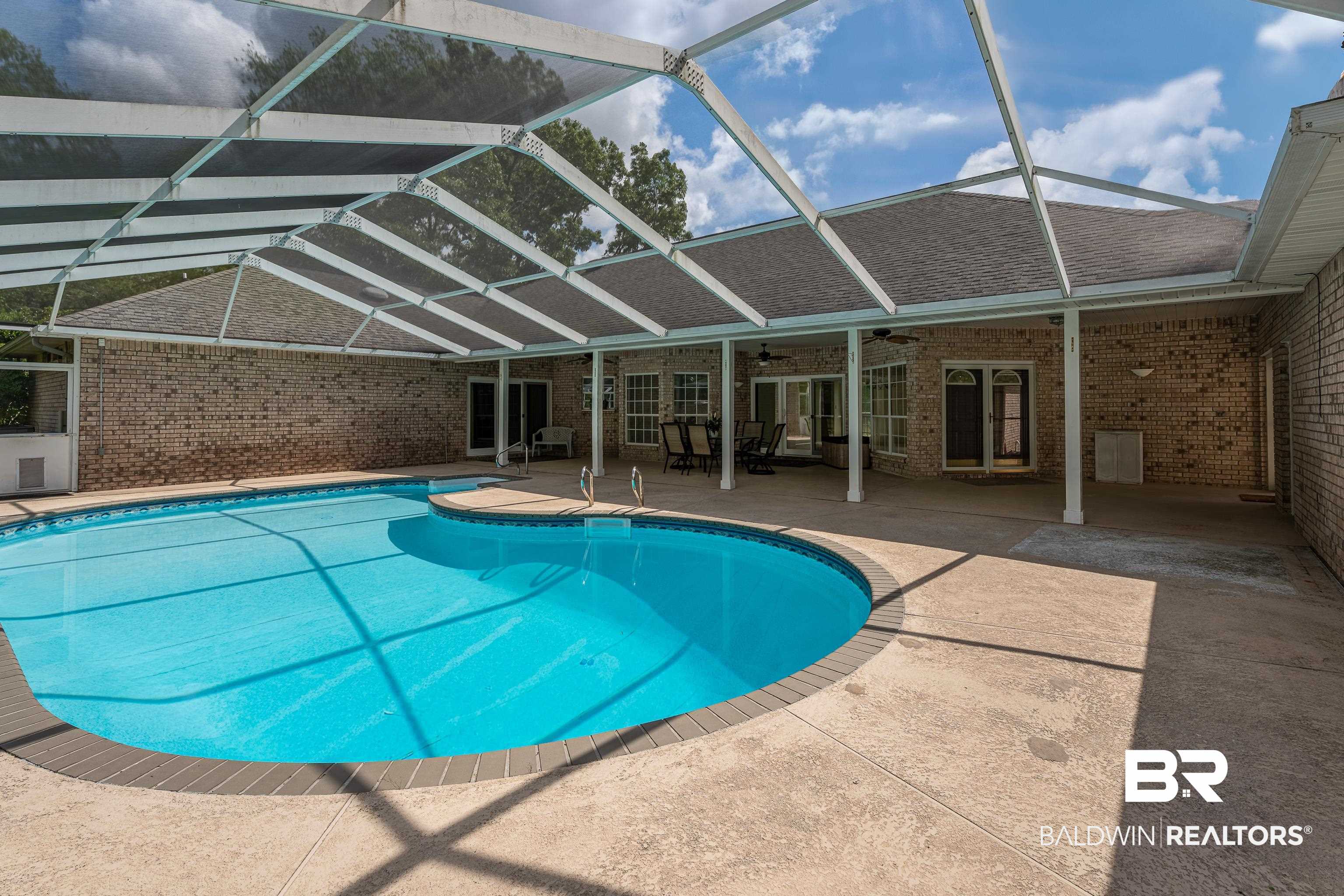 9530 Pilgrim Drive Elberta, AL 36530 - Photo 34 of 61 Pool with french doors, a patio, ceiling fan, and glass enclosure
