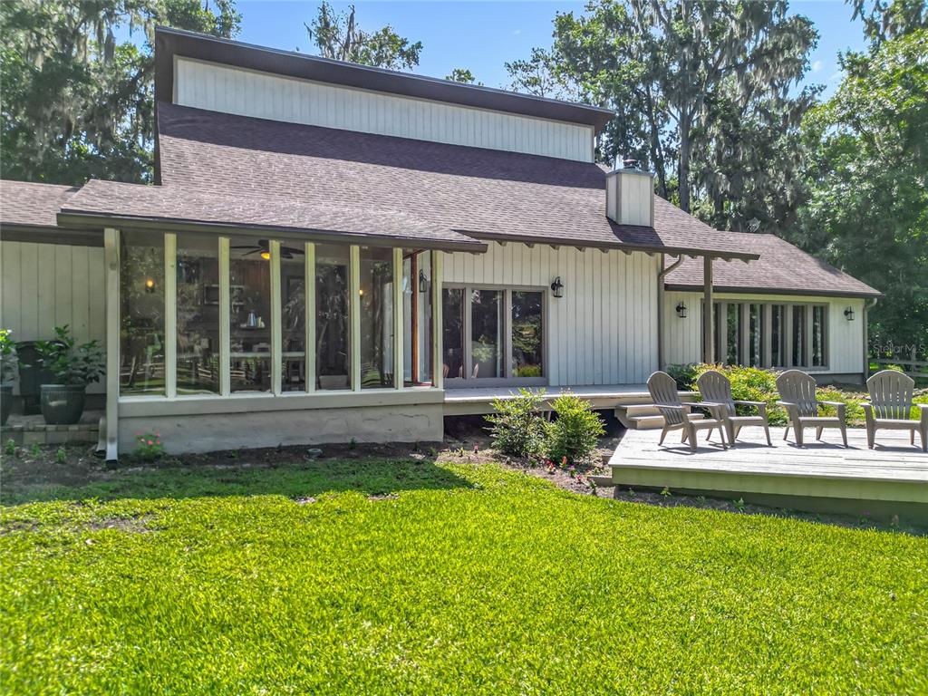 4661 Southwest 7th Avenue Road Ocala, FL 34471 - Photo 2 of 94 a view of a house with a yard porch and sitting area