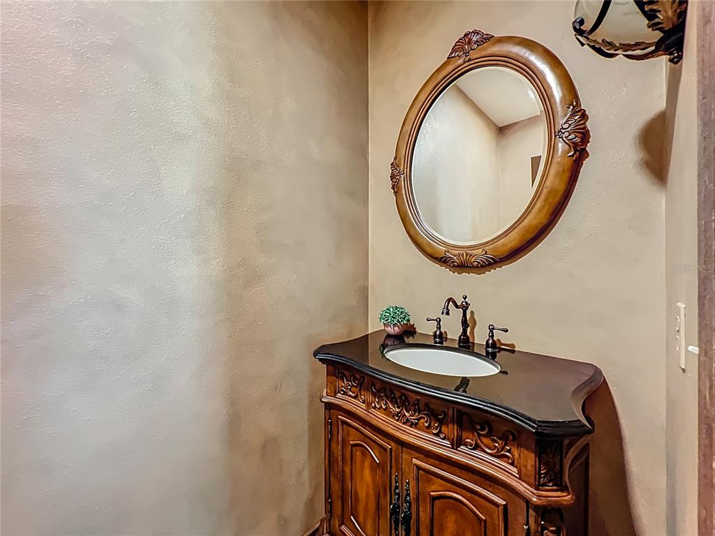 4661 Southwest 7th Avenue Road Ocala, FL 34471 - Photo 29 of 94 a bathroom with a sink a mirror and a window