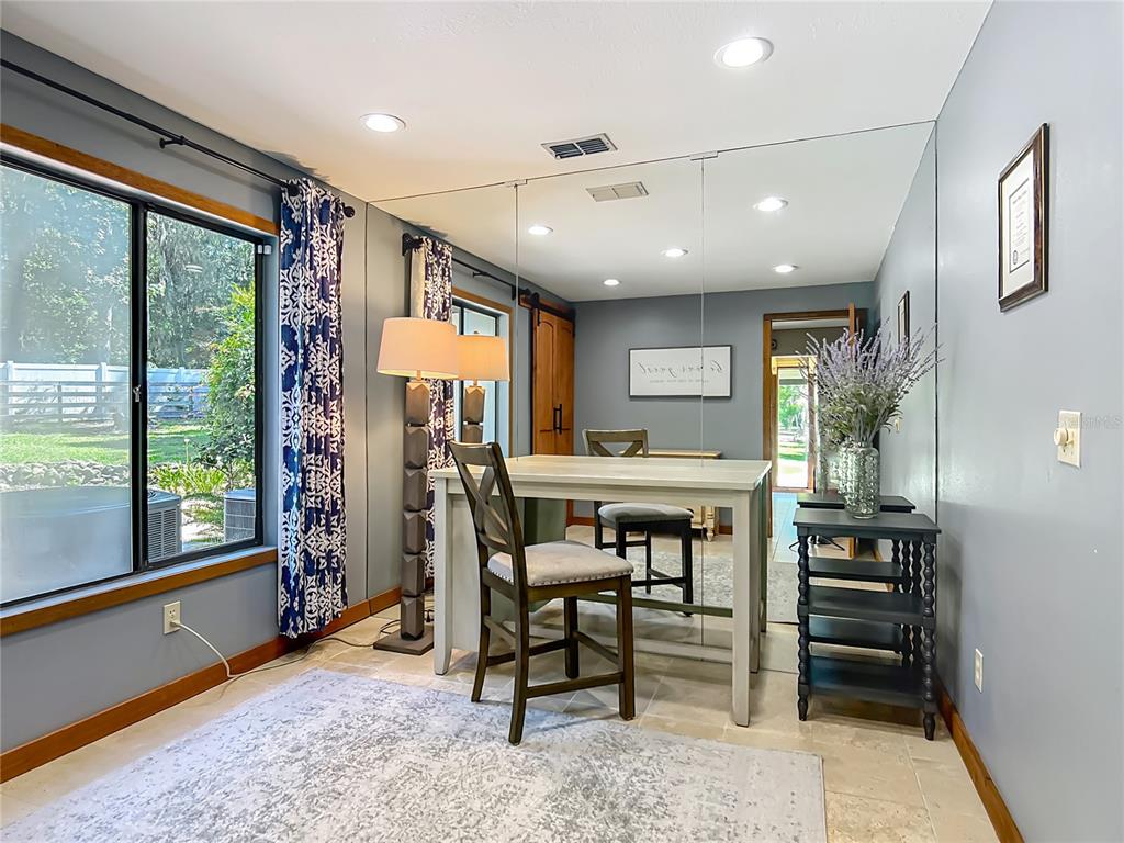 4661 Southwest 7th Avenue Road Ocala, FL 34471 - Photo 31 of 94 a view of a dining room with furniture window and outside view