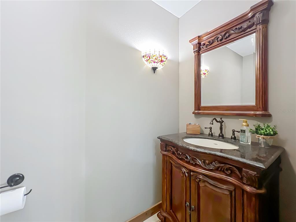 4661 Southwest 7th Avenue Road Ocala, FL 34471 - Photo 32 of 94 a bathroom with a sink and a mirror
