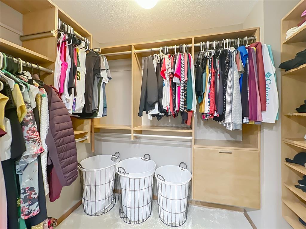 4661 Southwest 7th Avenue Road Ocala, FL 34471 - Photo 36 of 94 a view of walk in closet with clothes
