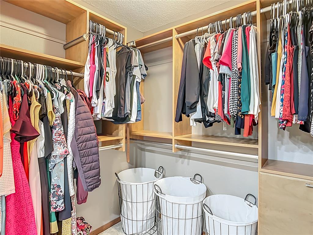4661 Southwest 7th Avenue Road Ocala, FL 34471 - Photo 37 of 94 a view of walk in closet with clothes and shoes