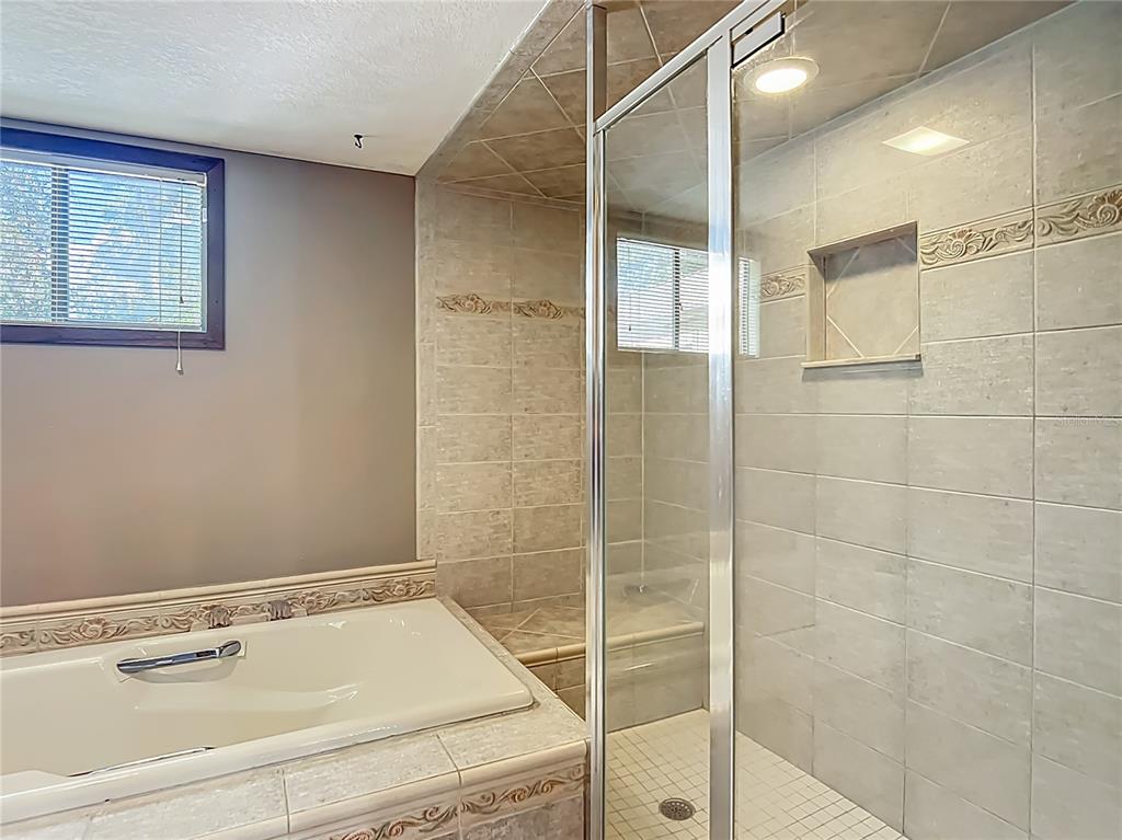 4661 Southwest 7th Avenue Road Ocala, FL 34471 - Photo 40 of 94 a bathroom with a sink and a shower