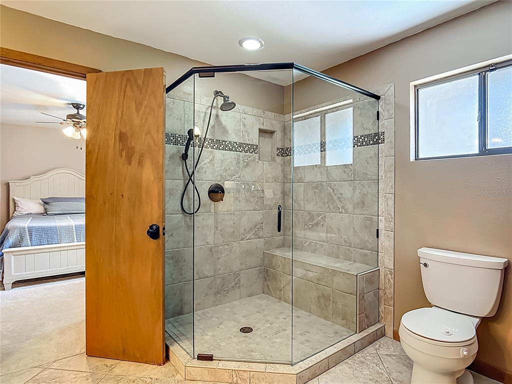 4661 Southwest 7th Avenue Road Ocala, FL 34471 - Photo 57 of 94 a bathroom with a shower and a toilet