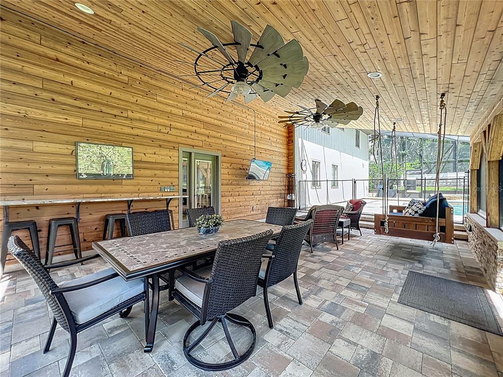 4661 Southwest 7th Avenue Road Ocala, FL 34471 - Photo 62 of 94 a view of a patio with table and chairs and potted plants