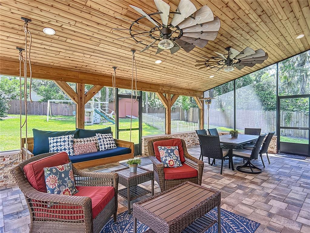 4661 Southwest 7th Avenue Road Ocala, FL 34471 - Photo 64 of 94 a outdoor living space with patio furniture and a potted plant