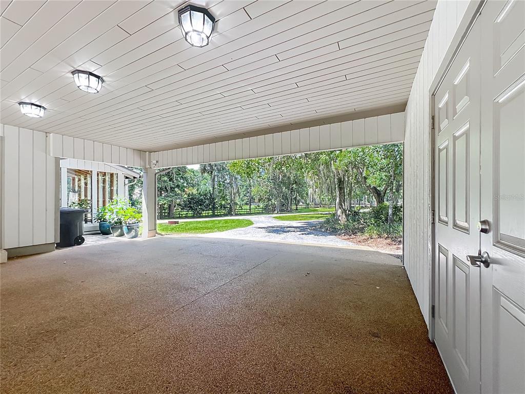 4661 Southwest 7th Avenue Road Ocala, FL 34471 - Photo 72 of 94 a view of empty room with floor to ceiling window and wooden floor