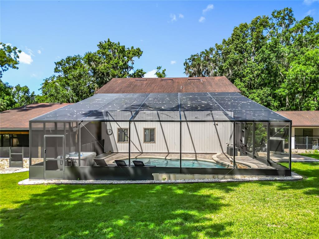 4661 Southwest 7th Avenue Road Ocala, FL 34471 - Photo 80 of 94 a view of a house with backyard porch and sitting area