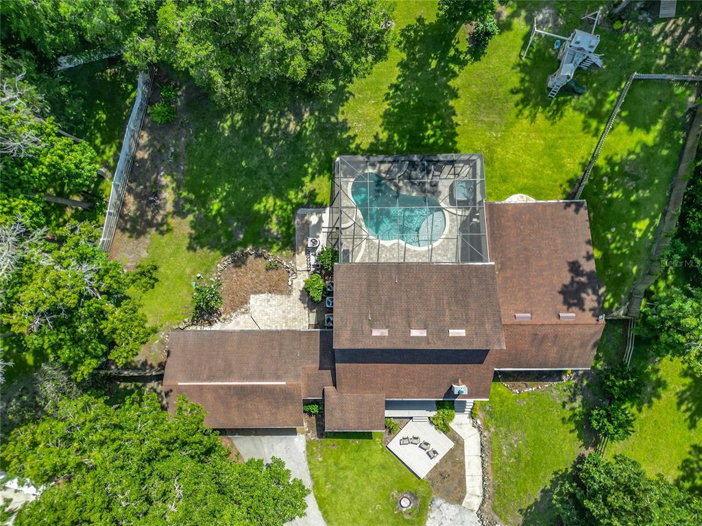 4661 Southwest 7th Avenue Road Ocala, FL 34471 - Photo 83 of 94 an aerial view of a house with a garden