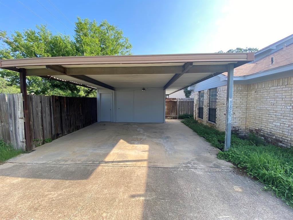 2110 Stone Moss Lane Grapevine, TX 76051 - Photo 14 of 14 a view of a patio with table and chairs with wooden fence