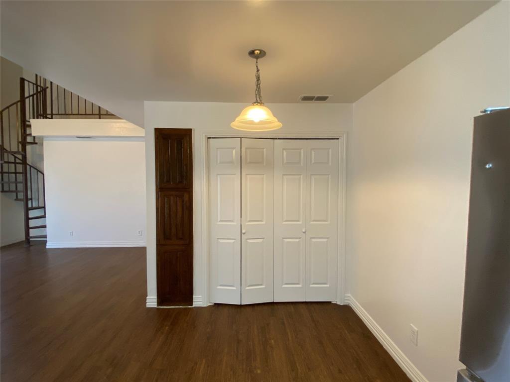 2110 Stone Moss Lane Grapevine, TX 76051 - Photo 7 of 14 an empty room with wooden floor and windows