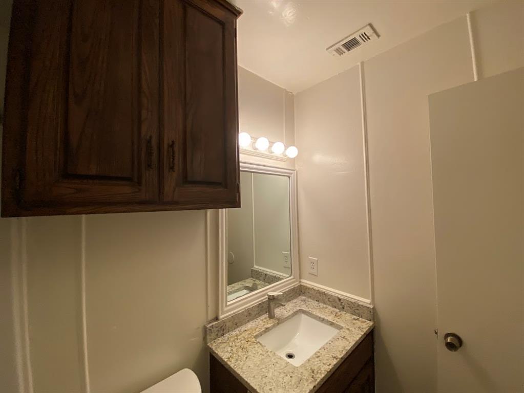 2110 Stone Moss Lane Grapevine, TX 76051 - Photo 8 of 14 a bathroom with a sink a mirror and shower
