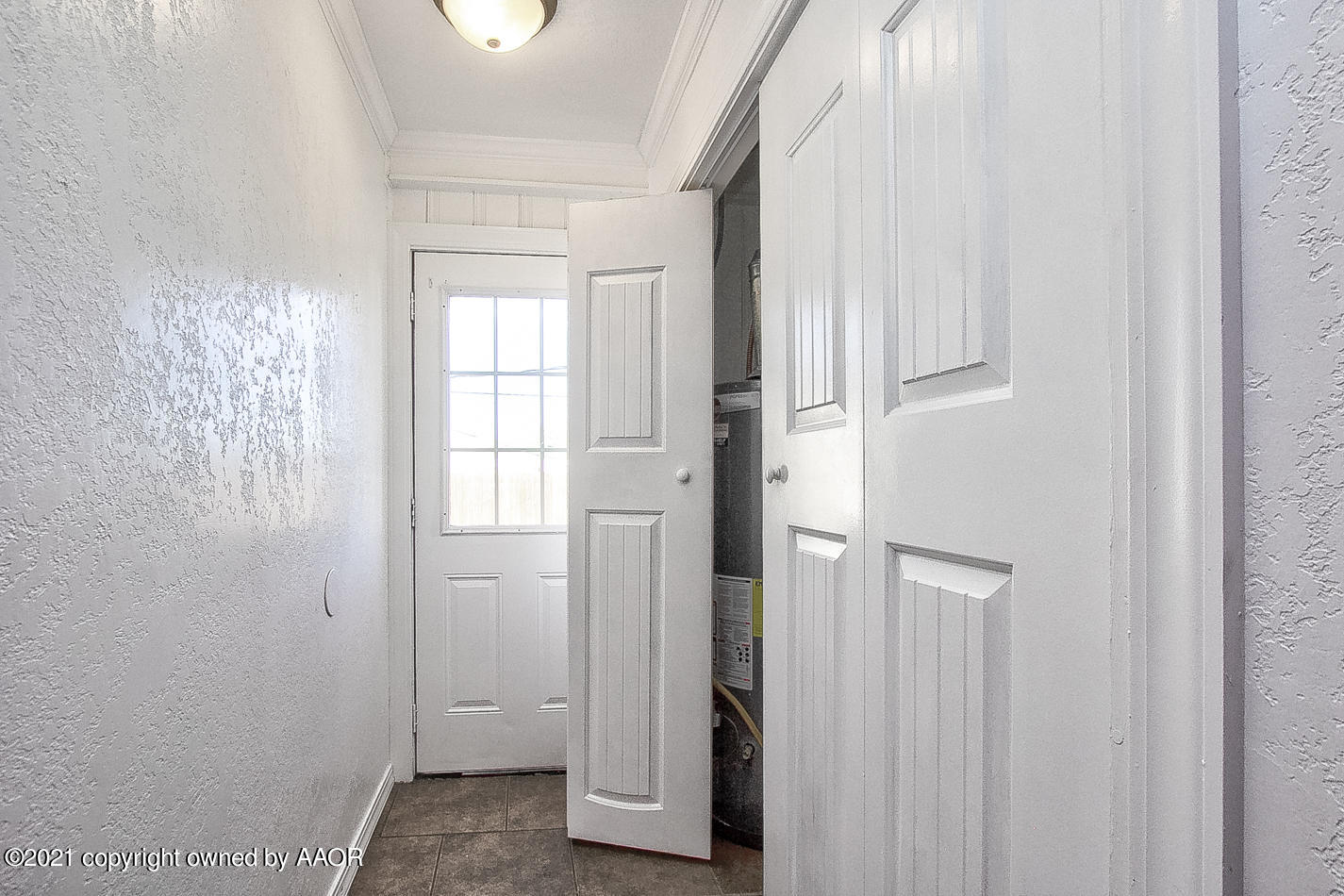 4431 Bowie Street Amarillo, TX 79110 - Photo 8 of 13 a view of an empty room with a window
