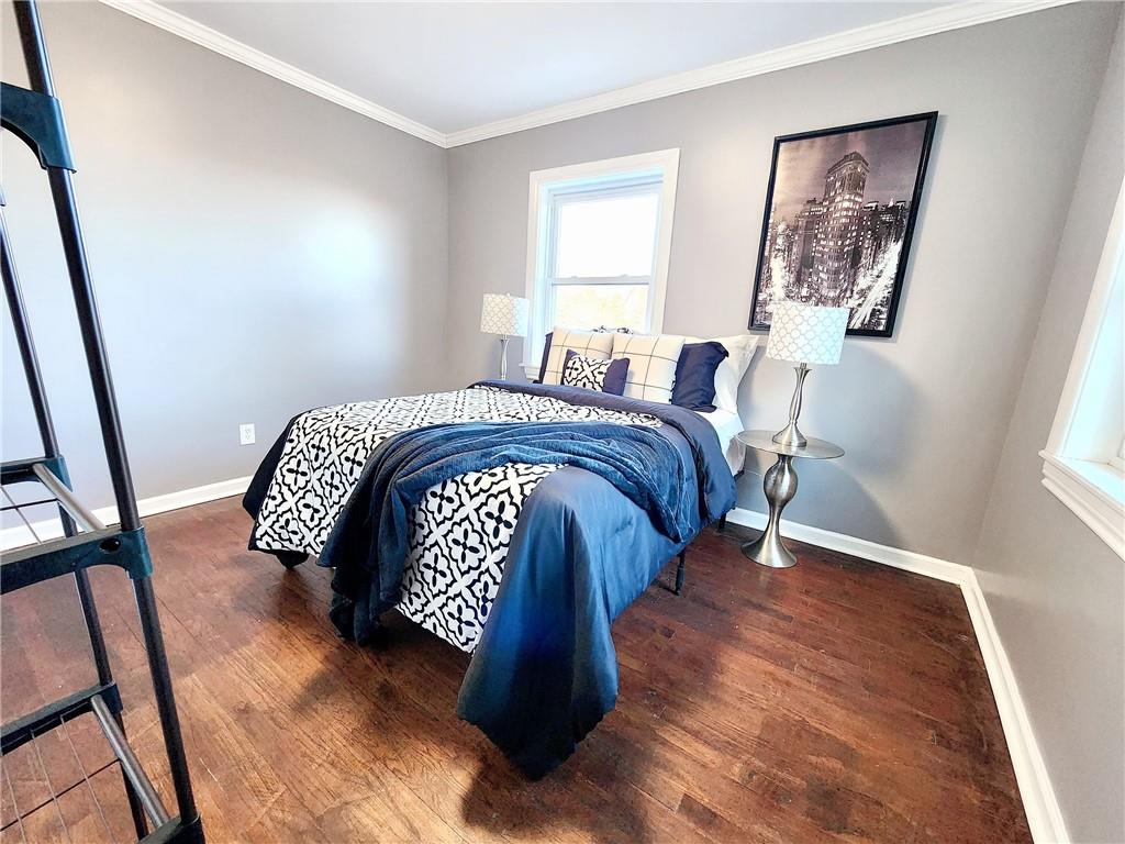 2630 Mt Royal Road Pittsburgh, PA 15217 - Photo 13 of 21 a bedroom with a bed lamp and a window