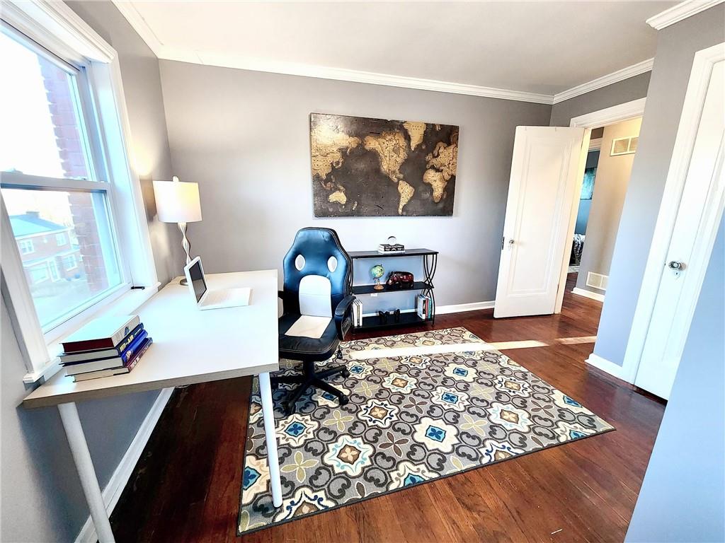 2630 Mt Royal Road Pittsburgh, PA 15217 - Photo 15 of 21 a bedroom with a bed and wooden floor