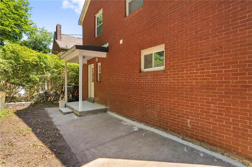 2630 Mt Royal Road Pittsburgh, PA 15217 - Photo 18 of 21 a view of a brick house with many windows