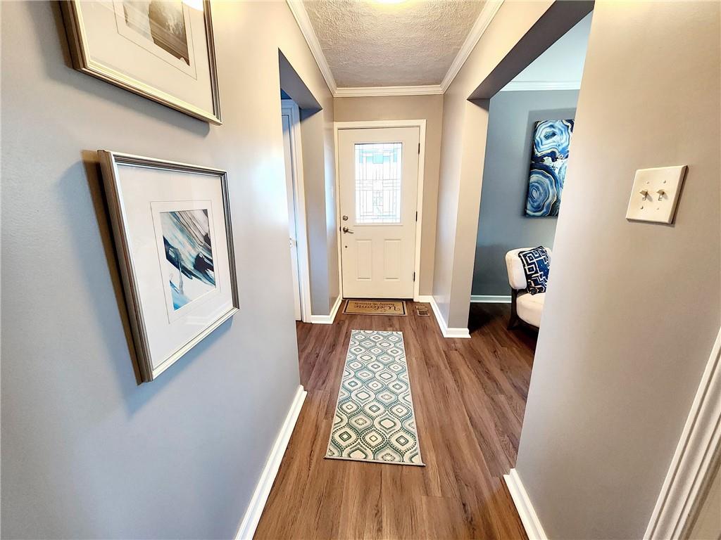 2630 Mt Royal Road Pittsburgh, PA 15217 - Photo 3 of 21 a view of a hallway with wooden floor and stairs