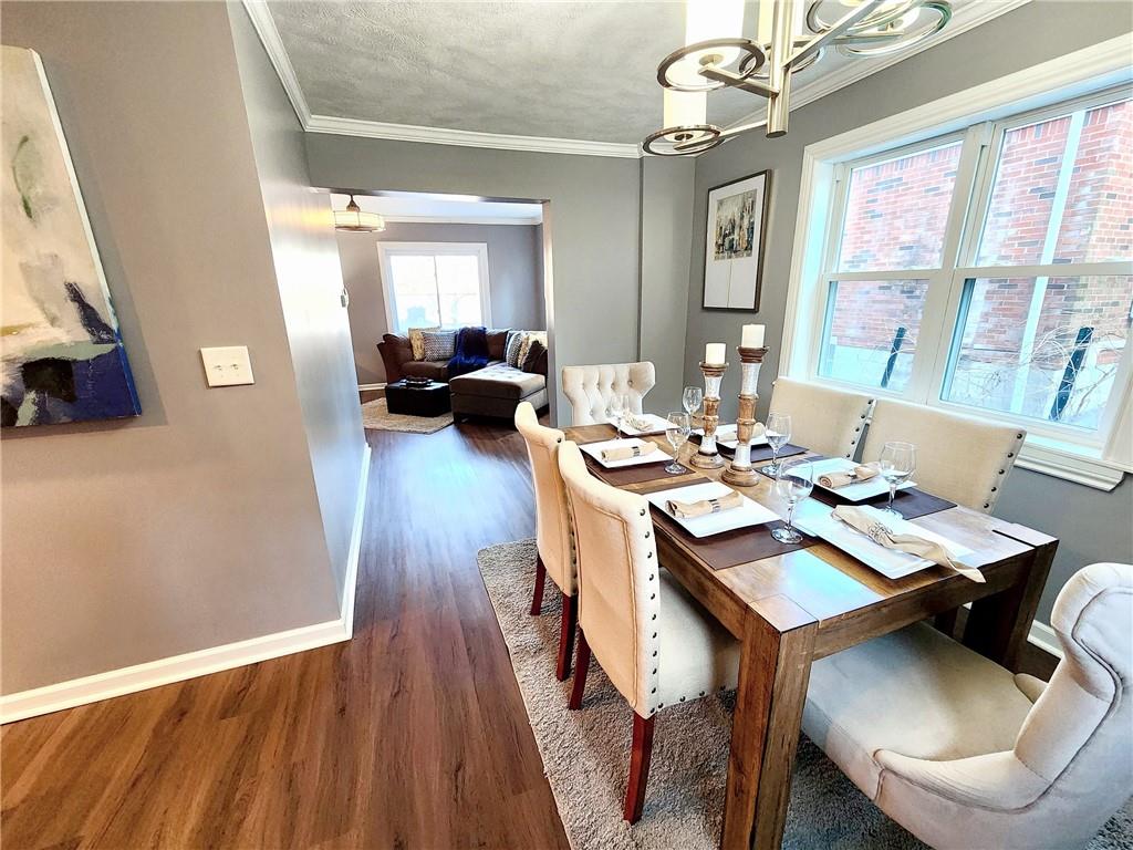2630 Mt Royal Road Pittsburgh, PA 15217 - Photo 6 of 21 a view of a dining room with furniture window and wooden floor