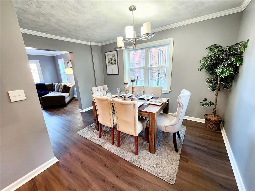 2630 Mt Royal Road Pittsburgh, PA 15217 - Photo 7 of 21 a dining room with furniture potted plants and wooden floor