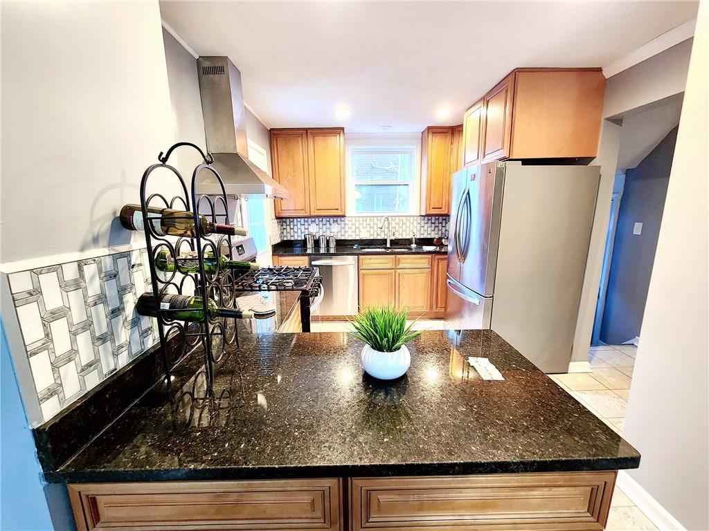 2630 Mt Royal Road Pittsburgh, PA 15217 - Photo 8 of 21 a kitchen with a table chairs and refrigerator