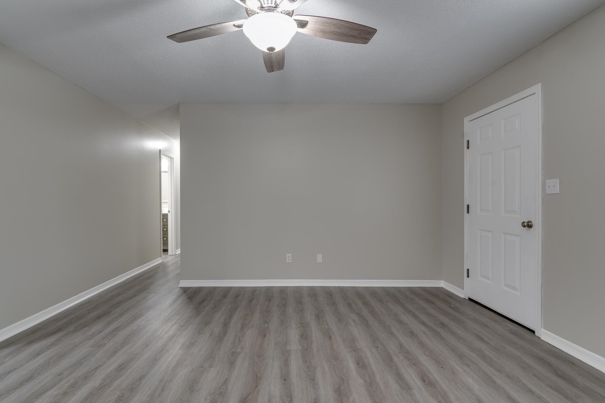 282 Volz Road Ripley, TN 38063 - Photo 9 of 25 a view of an empty room with wooden floor