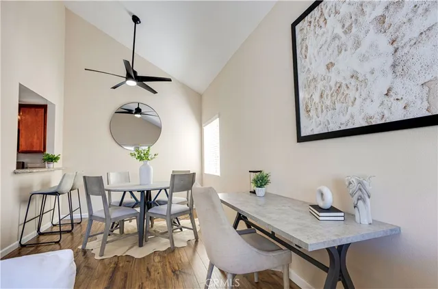 a view of a dining room with furniture and wooden floor
