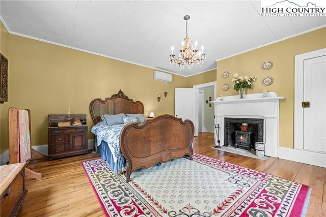 a living room with furniture rug and fireplace