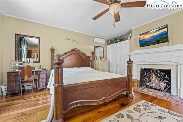 a bed room with a bed and a fireplace