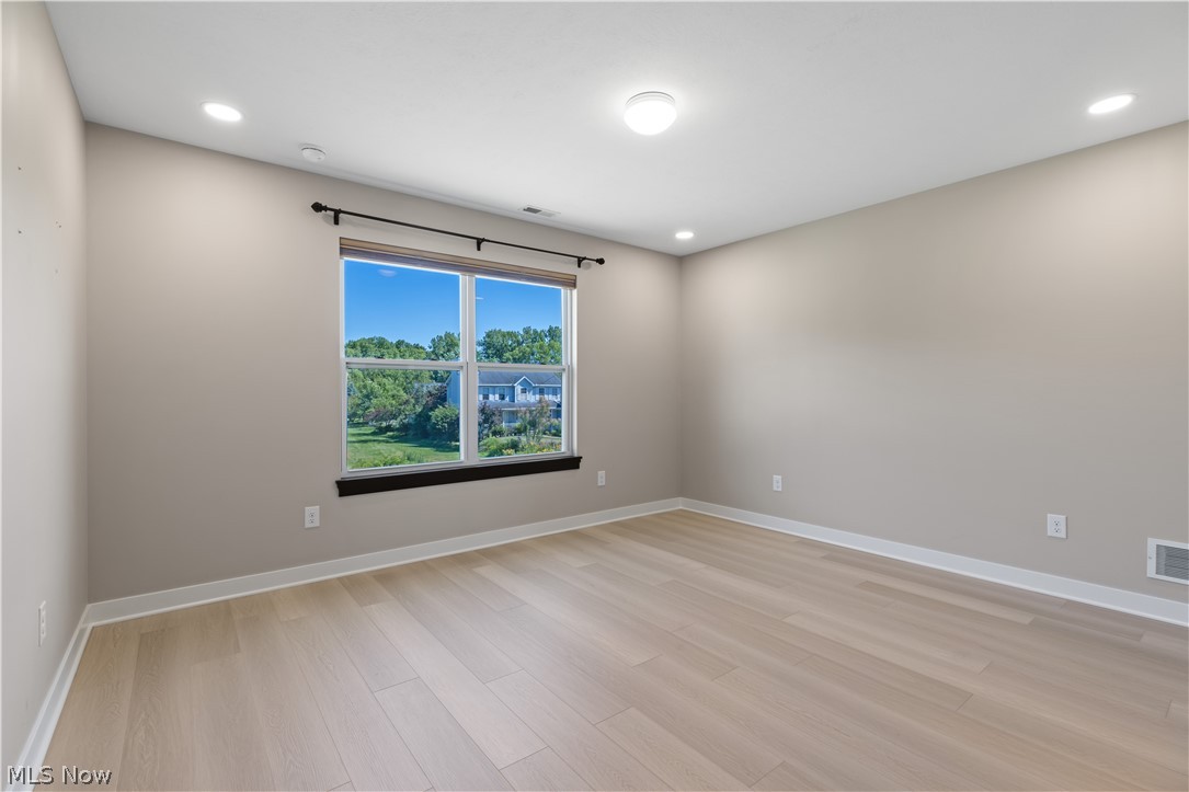 35799 Lorain Road North Ridgeville, OH 44039 - Photo 27 of 50 Empty room featuring light hardwood / wood-style floors