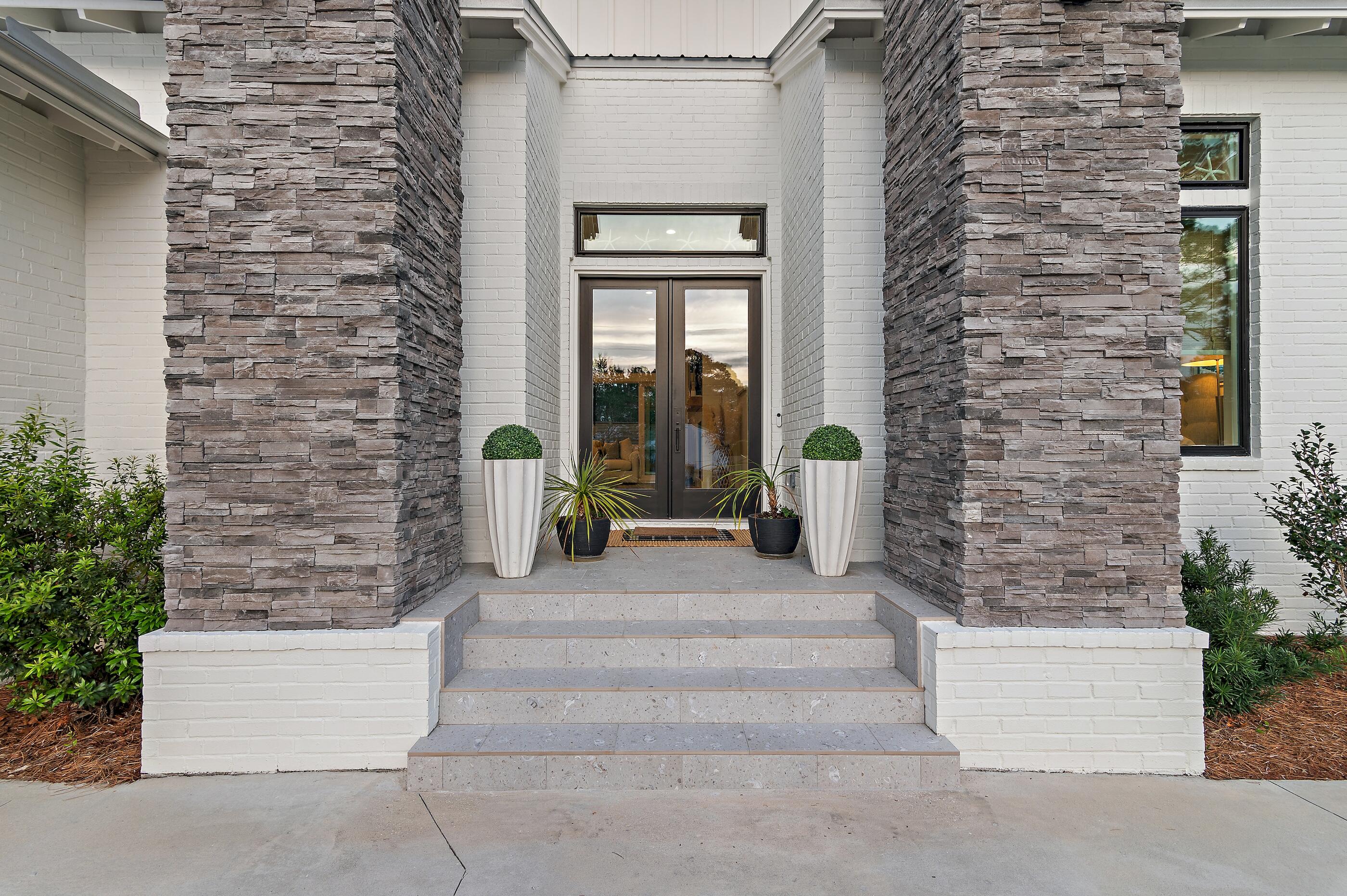 88 Beth Lane Santa Rosa Beach, FL 32459 - Photo 14 of 79 a front view of a house with potted plants