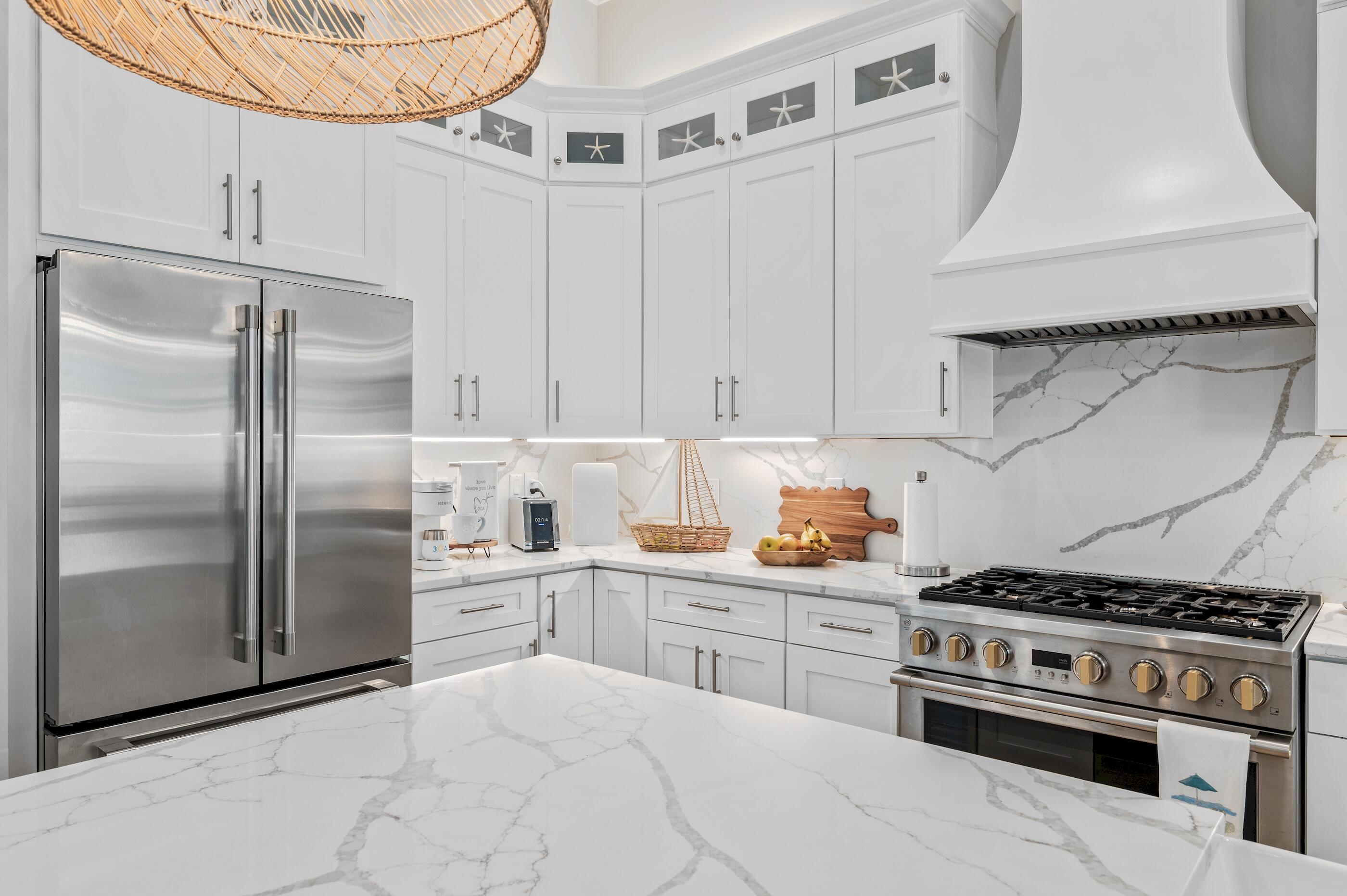 88 Beth Lane Santa Rosa Beach, FL 32459 - Photo 24 of 79 a kitchen with stainless steel appliances a stove a refrigerator and cabinets