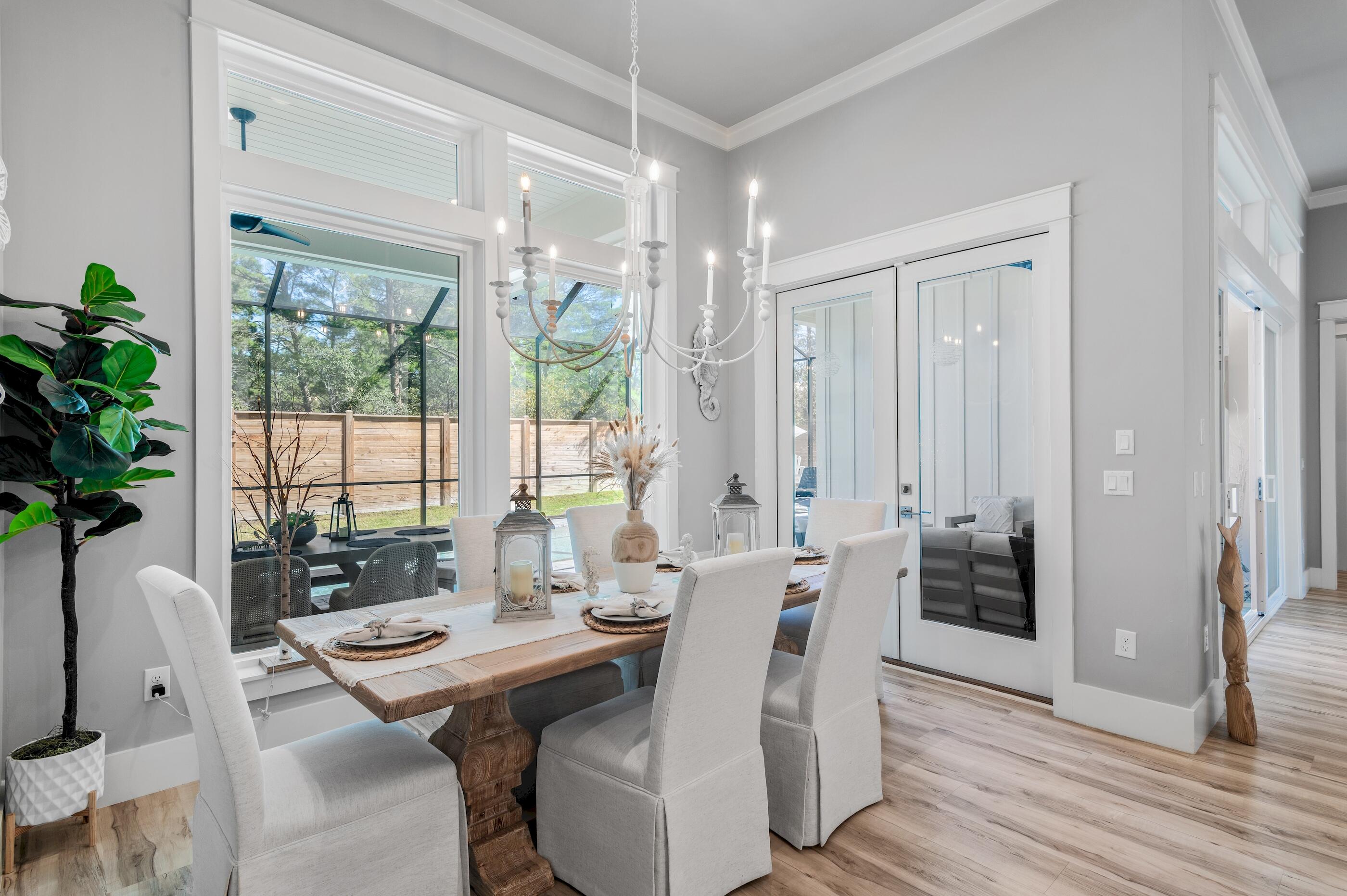 88 Beth Lane Santa Rosa Beach, FL 32459 - Photo 26 of 79 a view of a dining room with furniture window and wooden floor
