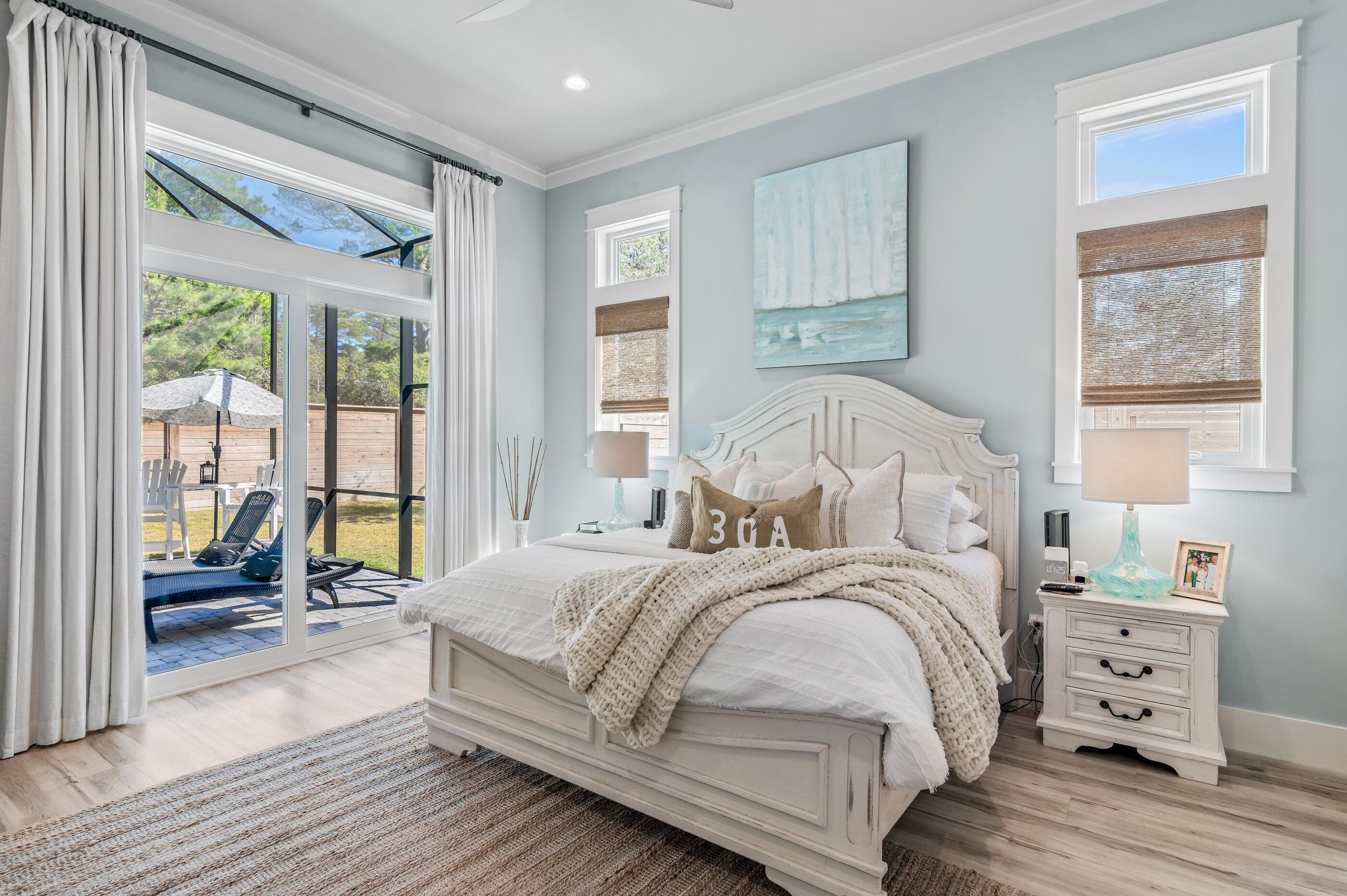 88 Beth Lane Santa Rosa Beach, FL 32459 - Photo 29 of 79 a bedroom with a bed and large windows