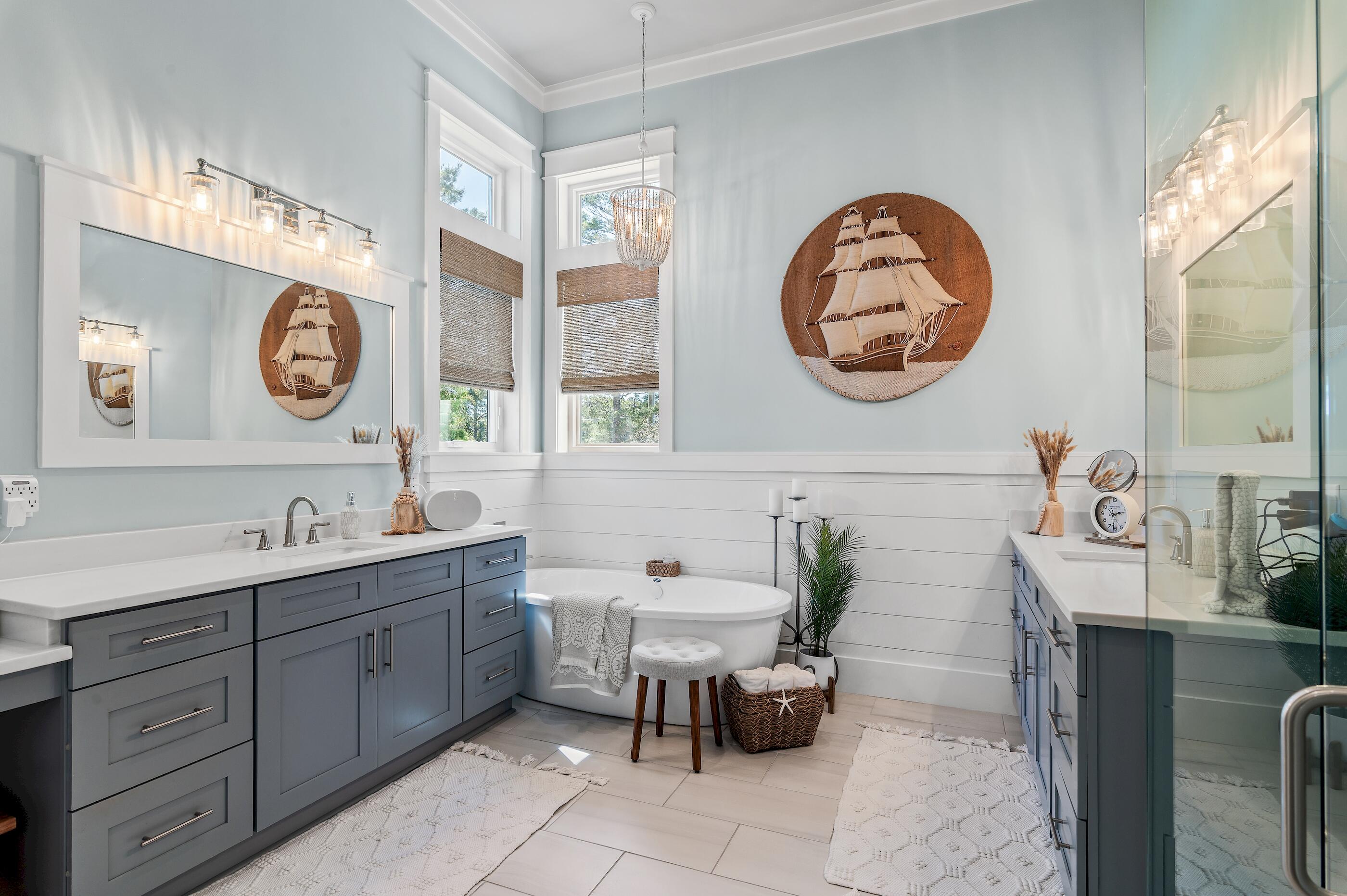 88 Beth Lane Santa Rosa Beach, FL 32459 - Photo 31 of 79 a bathroom with a two sink mirror and a clock on the wall