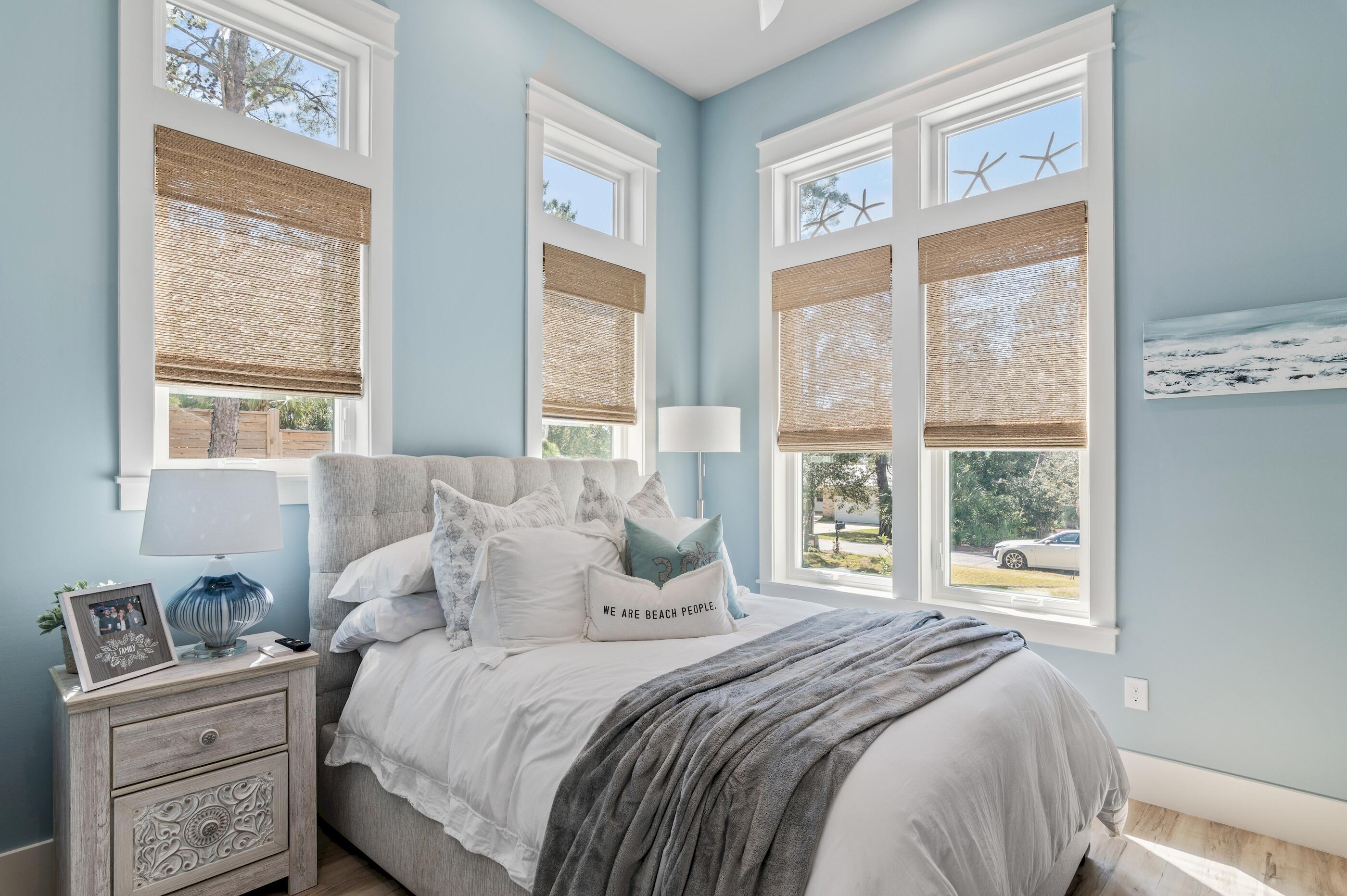 88 Beth Lane Santa Rosa Beach, FL 32459 - Photo 40 of 79 a bedroom with a bed and a window with chair