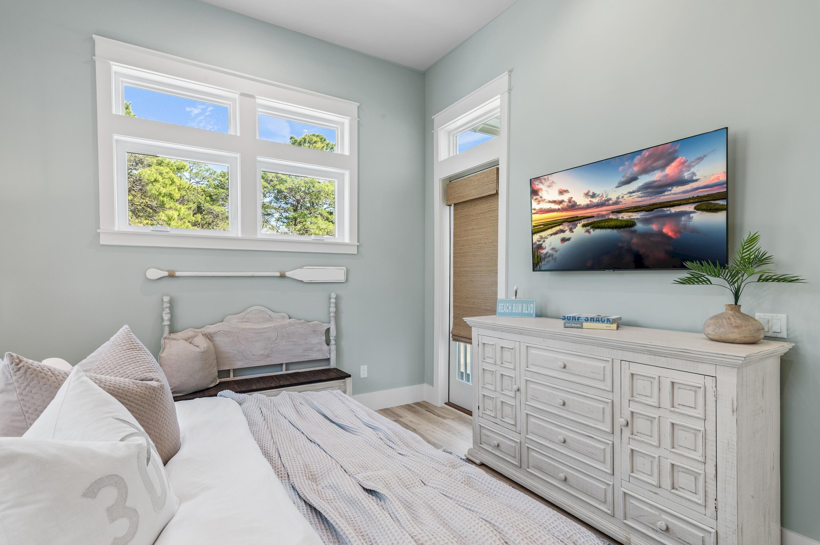 88 Beth Lane Santa Rosa Beach, FL 32459 - Photo 42 of 79 a bedroom with a bed and a flat screen tv